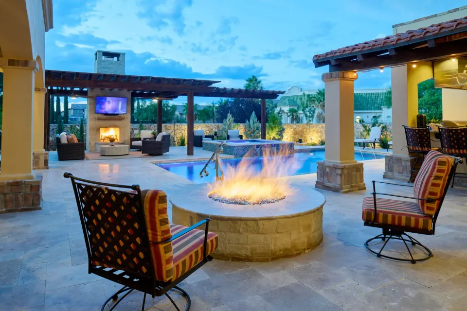The completed Desert Harmony outdoor space with pool, pergola, fire and desert planting.